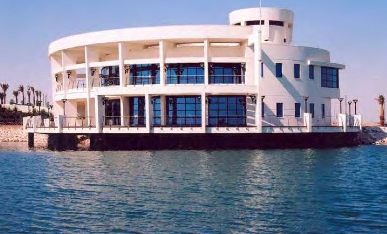 West Bay Lagoon Hotel marina building on the water